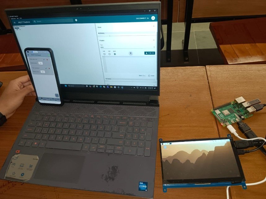 Complete setup: Pi with display, laptop running MQTT Explorer, phone running MQTT Dashboard.